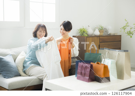 A woman returning home from shopping A woman returning home from shopping 126117904