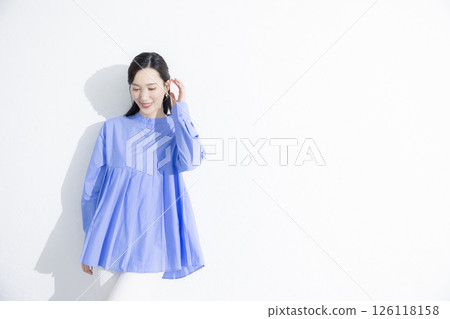 Woman wearing a blue dress 126118158