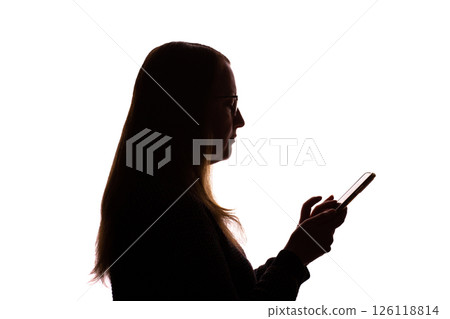Silhouette of young woman using smartphone on white background Silhouette of young woman using smartphone on white background 126118814
