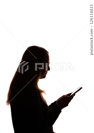 Silhouette of young woman using smartphone on white background Silhouette of young woman using smartphone on white background 126118815