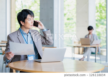 A businessman working in a cafe 126118834