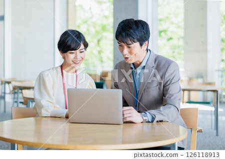 Business person doing desk work in a cafe 126118913