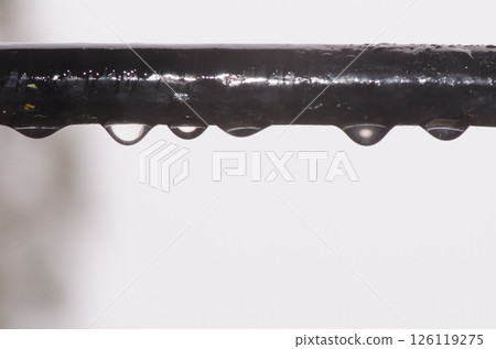 Water drops under the bar of a window. Water drops under the bar of a window. 126119275