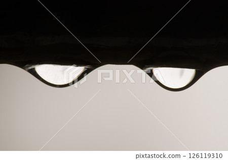 Water drops under the bar of a window. Water drops under the bar of a window. 126119310