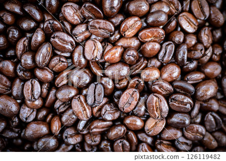 close up of roast coffee bean texture background with light and shadow, top view. coffee shop advertising background with copy space close up of roast coffee bean texture background with light and shadow, top view. coffee shop advertising background with copy space 126119482