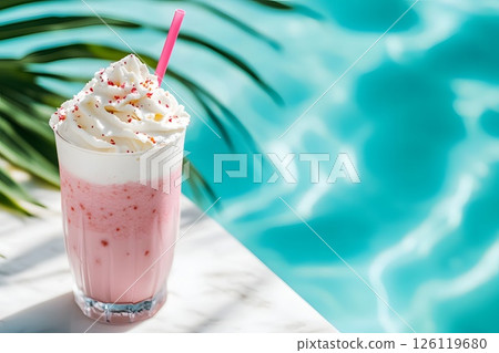 Horizontal banner with a strawberry fruit cocktail with a cap of whipped cream on the side of the pool, summer hotel vacation 126119680