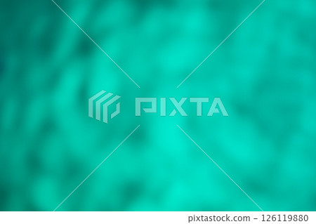 Green color image of swaying shadows on water (stock photo) 126119880