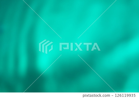 Green color image of swaying shadows on water (stock photo) 126119935