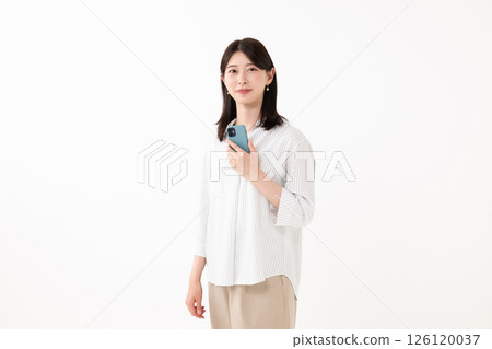 Woman holding a smartphone with a smile 126120037