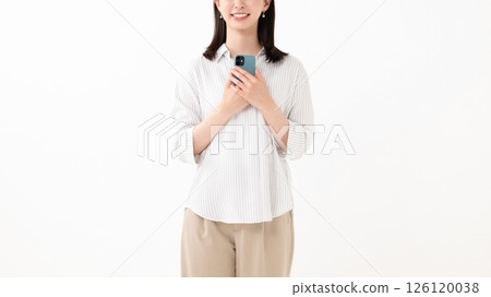 Woman holding a smartphone with a smile Woman holding a smartphone with a smile 126120038