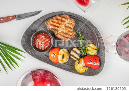 grilled pork steak with grilled vegetables. top view. copy space grilled pork steak with grilled vegetables. top view. copy space 126120303
