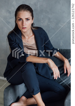 Portrait of a beautiful woman in a gray business suit Portrait of a beautiful woman in a gray business suit 126121742