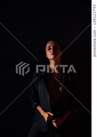 Portrait of a beautiful woman in a gray business suit 126121743