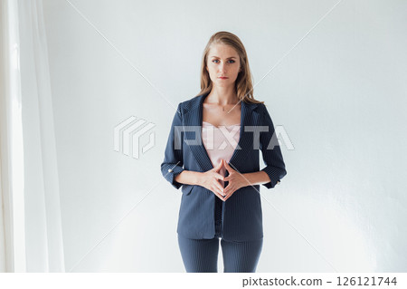 Portrait of a beautiful woman in a gray business suit Portrait of a beautiful woman in a gray business suit 126121744