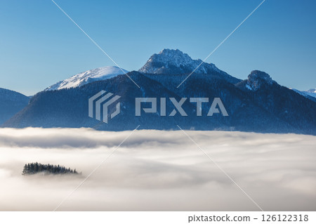 Snowy winter landscape in a misty sunny morning. The Mala Fatra national park in northwest of Slovakia, Europe. 126122318