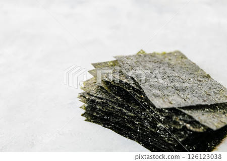 Homemade nori chip on neutral light background Homemade nori chip on neutral light background 126123038