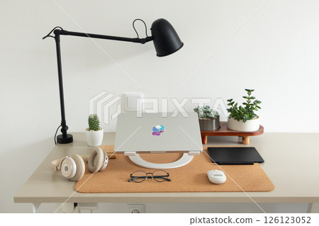Graphic designer or retoucher minimalist home office workspace beige desk. Remote work concept 126123052