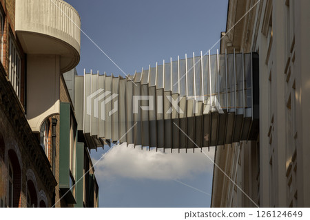 The futuristic modern of Twisted sky bridge connecting Royal opera house to Royal ballet school in Covent garden. 126124649