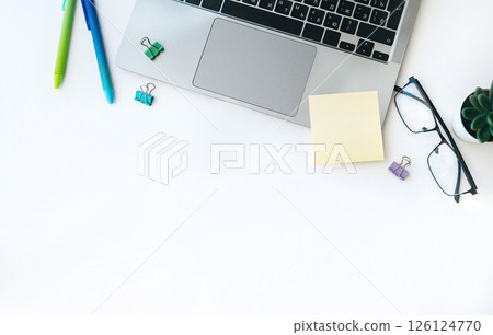 Flat lay home office workspace with laptop, diary, succulent plant and glasses on white background. Flat lay home office workspace with laptop, diary, succulent plant and glasses on white background. 126124770