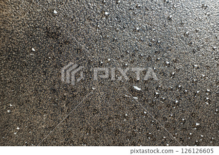 Water droplets on a cast iron macro surface. Cast iron cookware care, rust resistant, abstract pattern 126126605