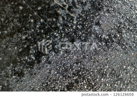 Rust stains on cast iron surface, macro 126126608