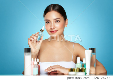 A young woman among the beauty products 126126758