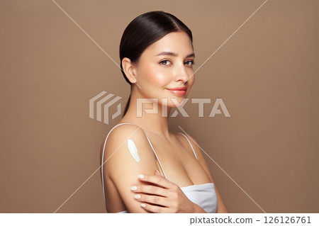 Woman with cream on shoulder Woman with cream on shoulder 126126761