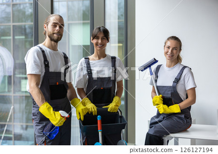 Team of housekeeping staff standing near the window in the office 126127194