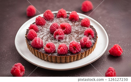 Raspberry Chocolate Tart, A decadent dessert featuring a rich chocolate filling complemented by tart raspberries, all nestled in a crisp, buttery pastry crust. AI Generated 126127230