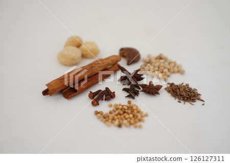 spices and herbs on a white background 126127311