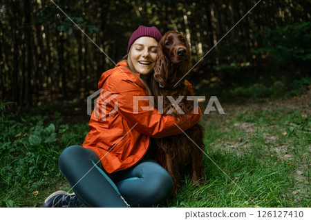 Joyful Moment with Dog in the Woods Joyful Moment with Dog in the Woods 126127410