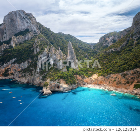 Aerial view of rocks and mountains, blue bay, beach, boats 126128014