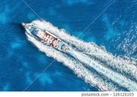 Aerial view of beautiful floating yacht in blue sea at sunny day 126128103