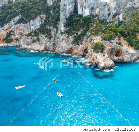 Aerial view of yacht and boats on blue sea at sunny day in summer Aerial view of yacht and boats on blue sea at sunny day in summer 126128108