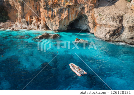 Aerial view of yacht and boats on blue sea at sunny day in summer Aerial view of yacht and boats on blue sea at sunny day in summer 126128121