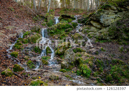 A beautiful waterfall with many sources 126128397