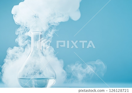 Glass flask with white smoke on a blue background, concept of chemistry, science, and experiments 126128721