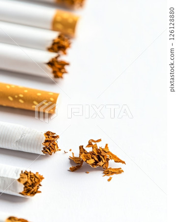 Pile of cigarettes with ash displaying smoking addiction 126128880