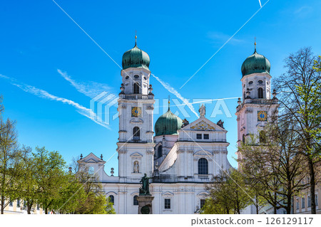 St. Stephans cathedral in Passau, Germany is an old white church with green metal domes on top of the towers 126129117