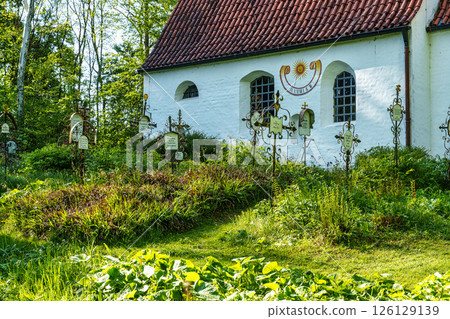 Church St.Clemens in Kranzberg near Freising, Bavaria with ancient graveyard and beautiful old wrought iron crosses Church St.Clemens in Kranzberg near Freising, Bavaria with ancient graveyard and beautiful old wrought iron crosses 126129139