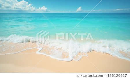 Ocean waves washing onto sandy tropical beach under blue sky. Turquoise sea water and white foam. Summer vacation and travel background 126129617
