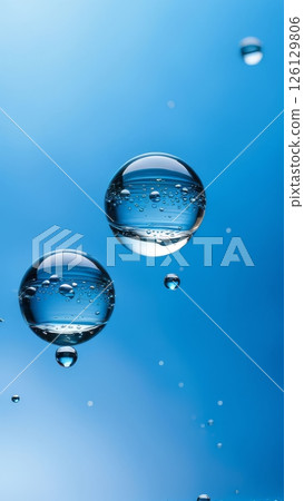 Macro shot of transparent water bubbles on blue background. Abstract floating liquid spheres with reflections and clarity 126129806