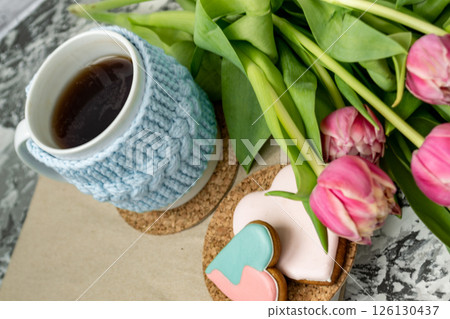 Pink tulips, an open book and a mug of freshly brewed coffee or tea. Spring set. Flatley layout 126130437