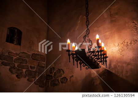 wrought iron chandelier with fake candles inside historic building wrought iron chandelier with fake candles inside historic building 126130594