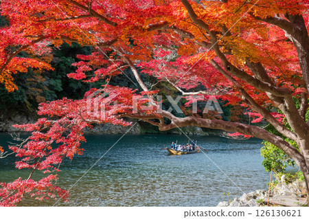 Tourist people on boat view fall leaf color by Katsura river, Arashiyama Tourist people on boat view fall leaf color by Katsura river, Arashiyama 126130621