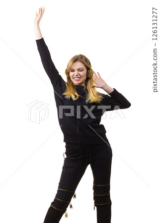 Teenage woman wearing headphones Teenage woman wearing headphones 126131277