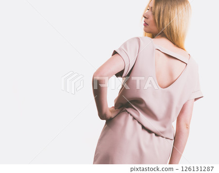 Female wearing casual pink tunic dress Female wearing casual pink tunic dress 126131287