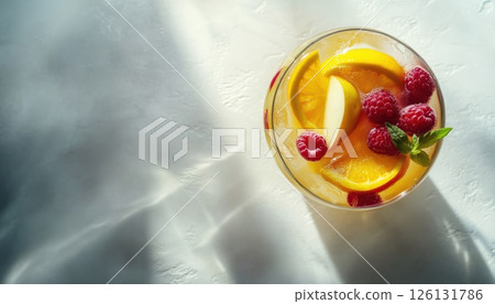 Refreshing Summer White Sangria With A Medley Of Fruits And Berries, Infused With Apple, Lemon, Oranges, And Raspberry. Light Concrete Table With Ample Space For Copy. Refreshing Summer White Sangria With A Medley Of Fruits And Berries, Infused With Apple, Lemon, Oranges, And Raspberry. Light Concrete Table With Ample Space For Copy. 126131786