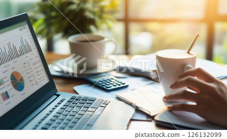 Smart Asian Businesswoman Enjoys Working On Laptop And Sipping Coffee In Modern Home Office With 126132099