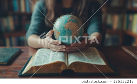 Christian Woman Praying For Global Peace And World Healing With Bible On Wooden Table Christian Woman Praying For Global Peace And World Healing With Bible On Wooden Table 126132212